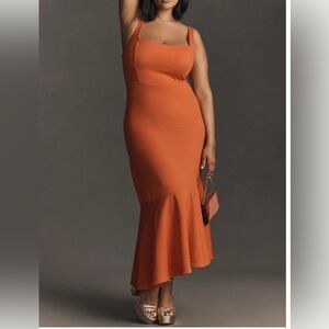 Beautifully flattering dress! Fun asymmetrical hemline, in a fierce orange hue.